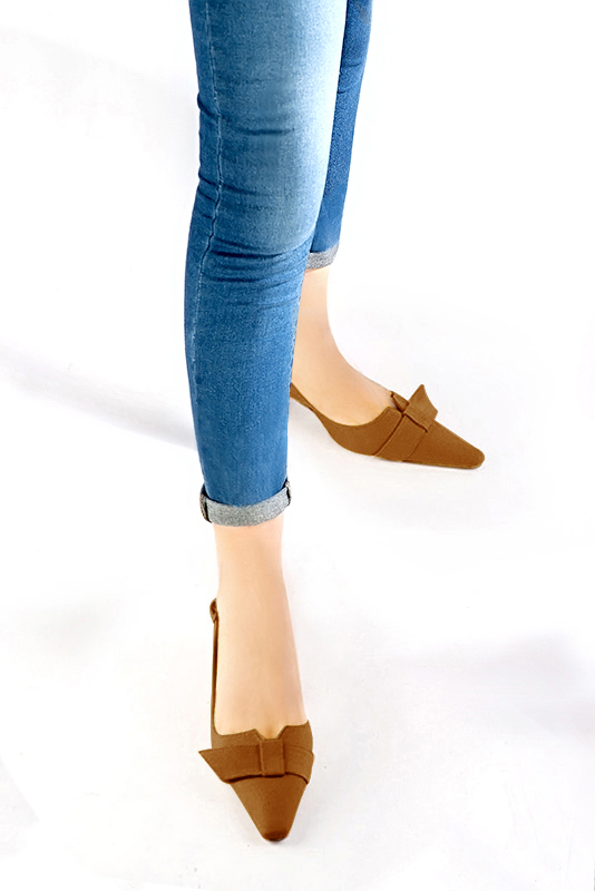 Women's camel beige elegant slingback heels, with a bow on the front. Tapered toe. Medium spool heels - Worn view